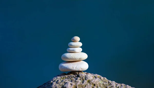 Balanced several white stones on blurred beautiful background