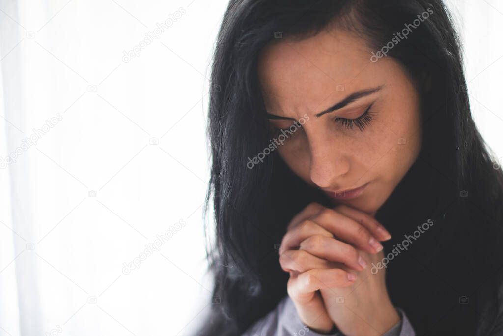 Portrait of woman praying