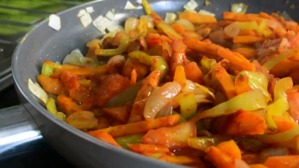 Different vegetables in a frying pan — Stock Video