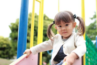 Japanese girl on the slide (2 years old) clipart