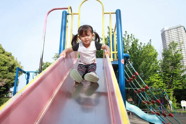 Japanese girl on the slide (2 years old) — Stock Photo, Image