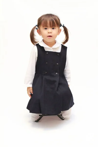 Japanese girl on the chair in formal wear (2 years old) — Stock Photo, Image