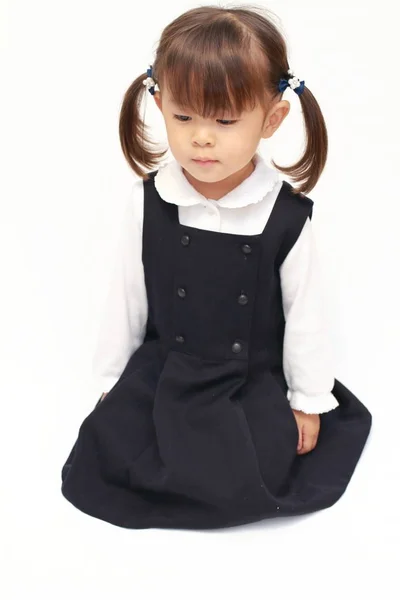 Japanese girl on the floor in formal wear (2 years old) Stock Picture