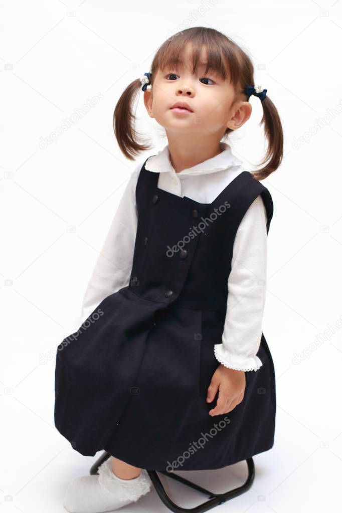 Japanese girl on the chair in formal wear (2 years old)