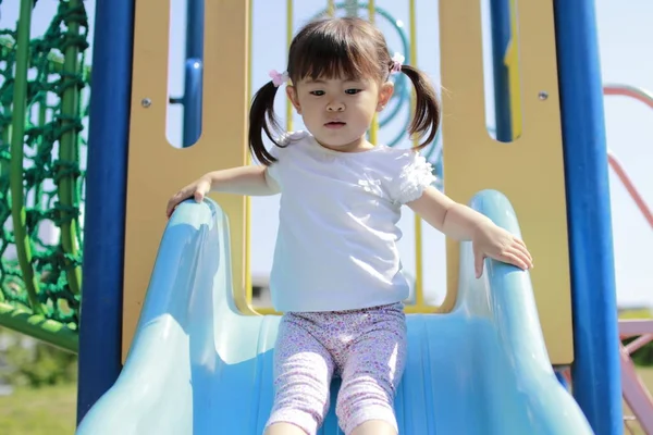 Japanese girl on the slide (2 years old)