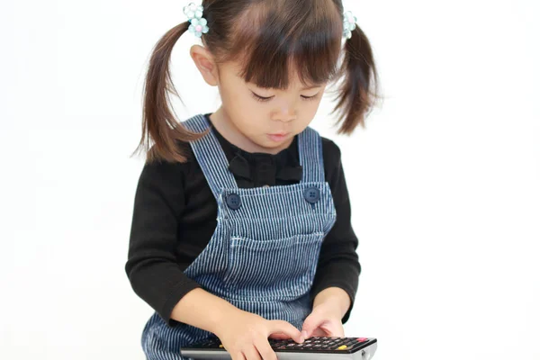 Japán lány használ távoli ellenőr (3 éves korig) — Stock Fotó