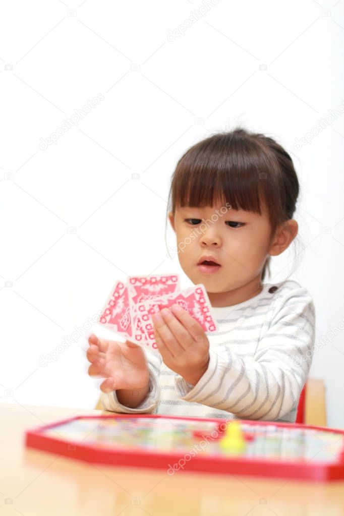 Japanese girl playing with boardgame (3 years old)