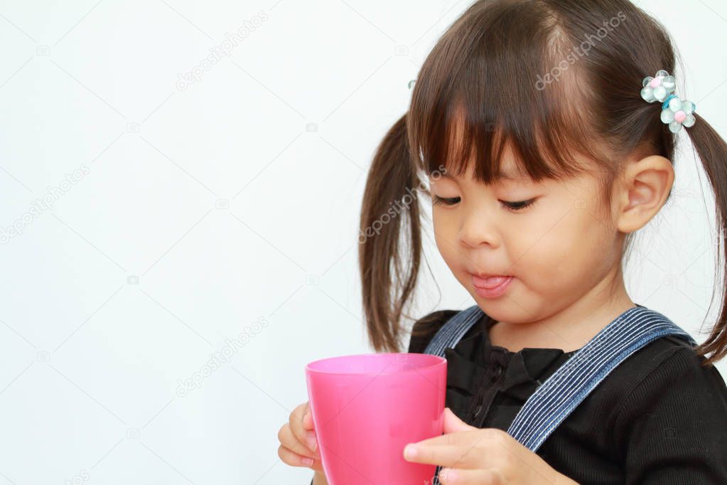 Japanese girl drinking water (3 years old)