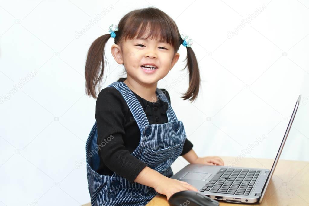 Japanese girl using notebook PC (3 years old)