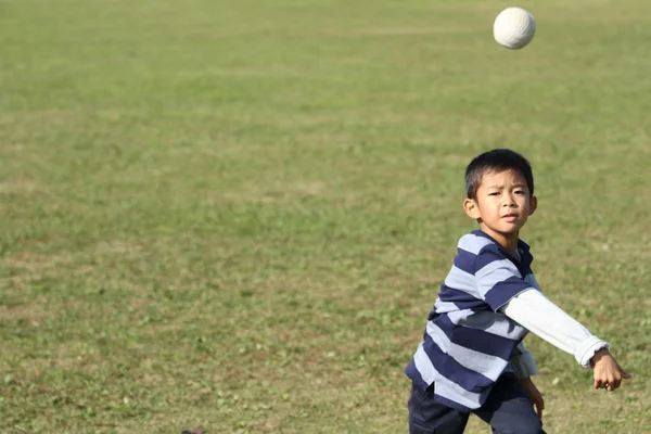 Japanese boy playing catch (second grade at elementary school)