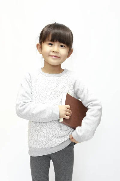 Japońska Dziewczyna Trzyma Książkę Białe Plecy Lat — Zdjęcie stockowe