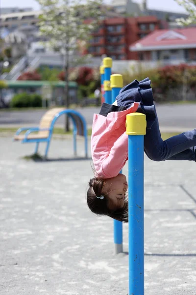 Japanese girl playing with high bar (5 years old)