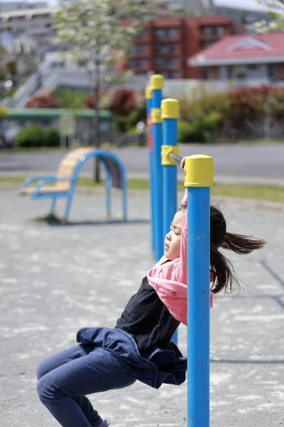 Japanese girl playing with high bar (5 years old)