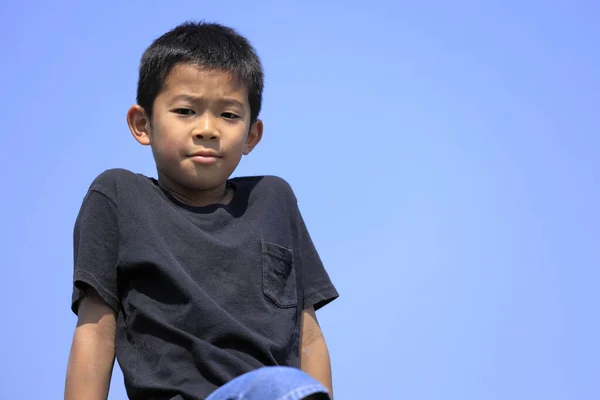 Japanese boy under the blue sky (fifth grade at elementary school)
