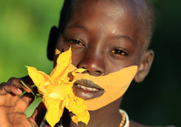 Young Suri woman in South Omo, Ethiopia