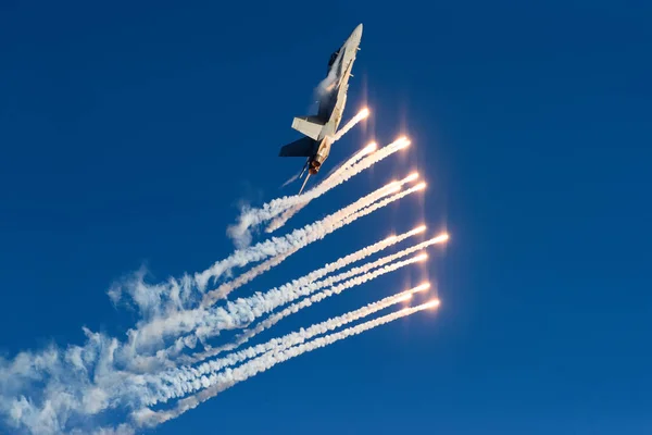 Finnish Air Force Hornet F/A-18  shooting out flares Stock Photo
