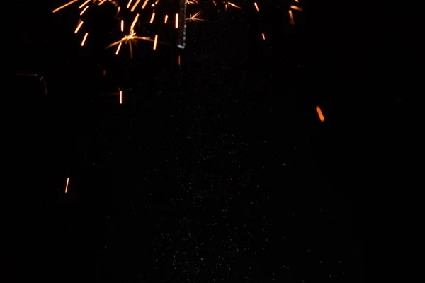 Brilhante brilho festivo Natal sparkler na mão tonificação — Fotografia de Stock