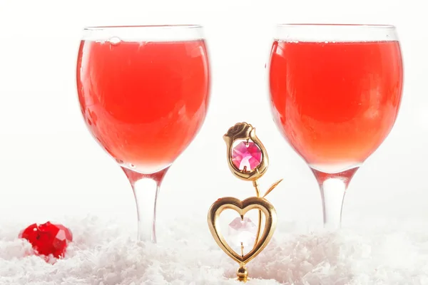 Red jelly hearts in champagne glasses over white background — Stock Photo, Image