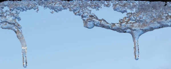 Icicles sparkling white with water drops ice hanging down — Stock Photo, Image