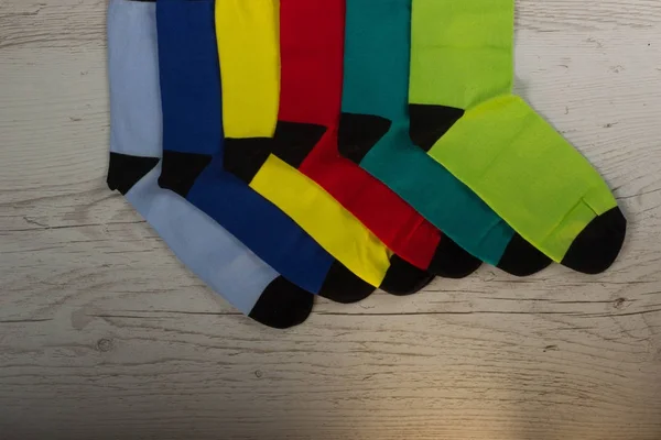 Tekstil renkli arka plan çorap. Yeşil, pembe, kırmızı, mavi, sarı ve diğer renkler — Stok fotoğraf
