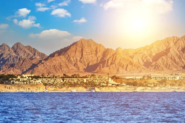 Wonderful solar Red Sea beach at a luxury hotel, at sunset. Sharm El Sheikh, Sinai, Egypt.