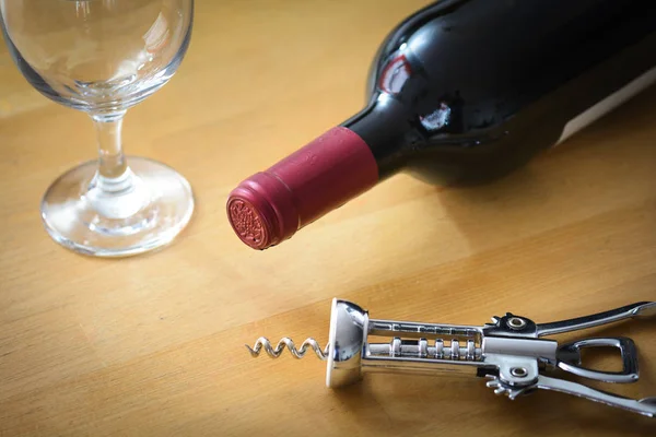 Bottle of red wine with glasse and corkscrew — Stock Photo, Image