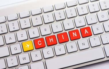 Çin uçak kroki ile beyaz klavyede yazma