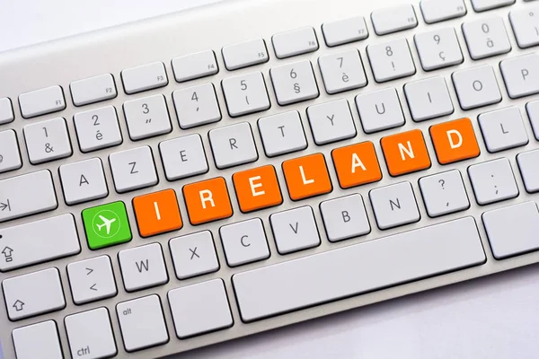 IRELAND writing on white keyboard with a aircraft sketch