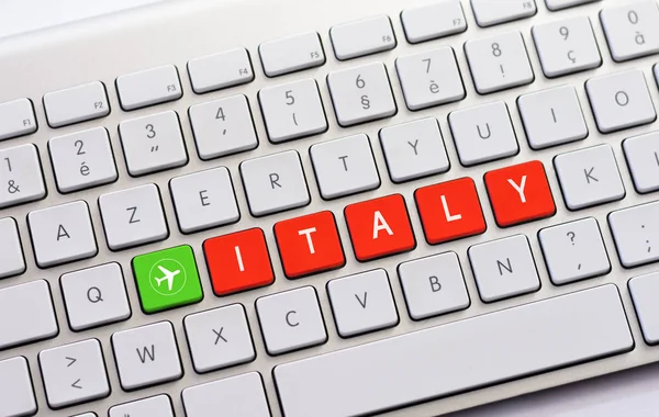 Itálie, psaní na bílé klávesnice s náčrtek letadla — Stock fotografie