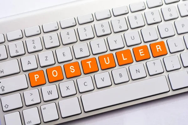 Escritura POSTULER en teclado blanco —  Fotos de Stock