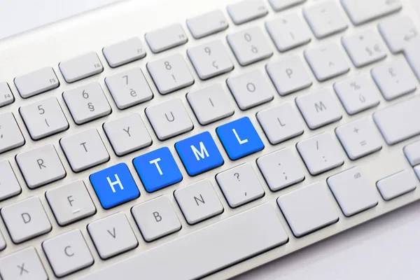 HTML escrita no teclado branco — Fotografia de Stock