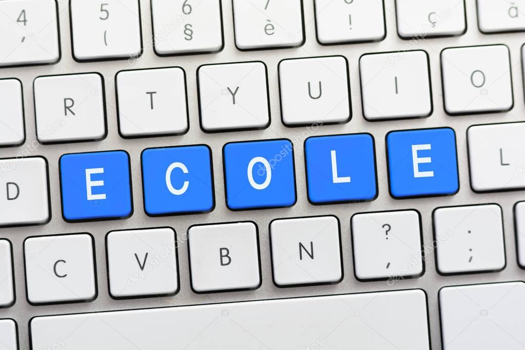 ECOLE writing on white keyboard