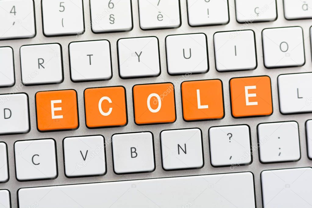 ECOLE writing on white keyboard