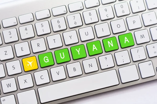 GUYANA writing on white keyboard with a aircraft sketch