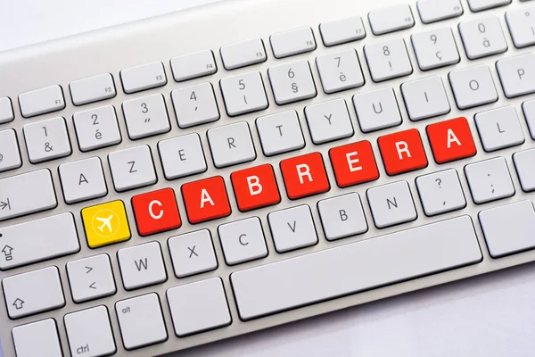 CABRERA scrittura su tastiera bianca con schizzo aereo — Foto Stock