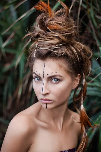 Portrait of wild amazon woman in the forest.