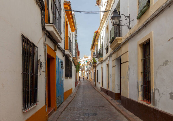 Narrow street with traditional Spanish architecture in Cordoba. Spain. Andalusia.