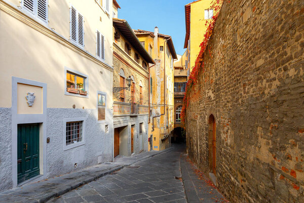 An ancient traditional medieval street in the historic part of Florence. Italy.