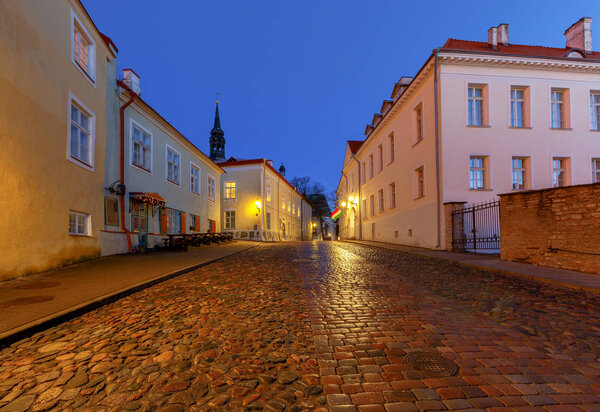 Old stone medieval street in the historic part of the city at dawn. Tallinn. Estonia.