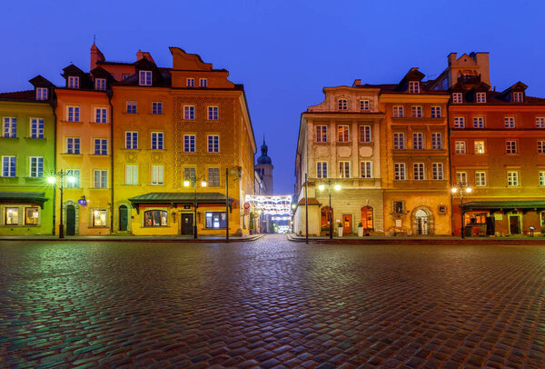 View of the royal square and colorful facades of old houses at dawn. Poland. Warsaw.