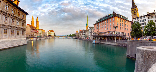 Zurich. Panoramic view of the city promenade and the facades of medieval houses at dawn. Switzerland.