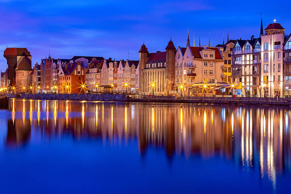 City embankment and facades of medieval houses in the old city at dawn. Gdansk. Poland.