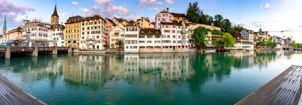 Zurich. Panoramic view of the city promenade and the facades of medieval houses at dawn. Switzerland.