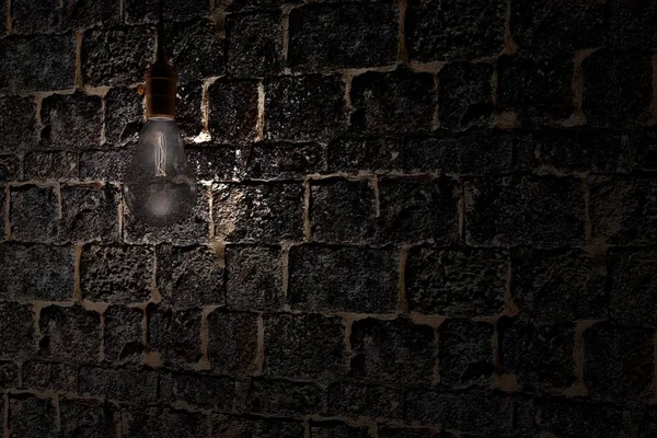 Decorative antique edison style light bulb against brick wall background — Stock Photo, Image