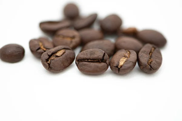 Close up of coffee beans on a white background — ストック写真