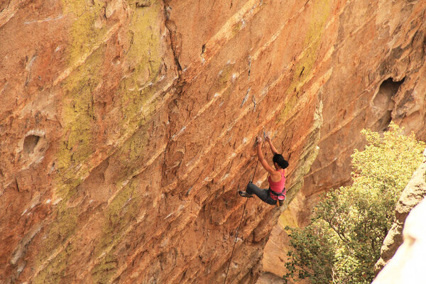 Woman Lead Rock Climbing a Hoodoo in Arizona