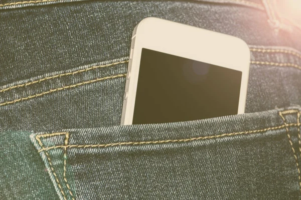 Smartphone in a jeans pocket — Stock Photo, Image