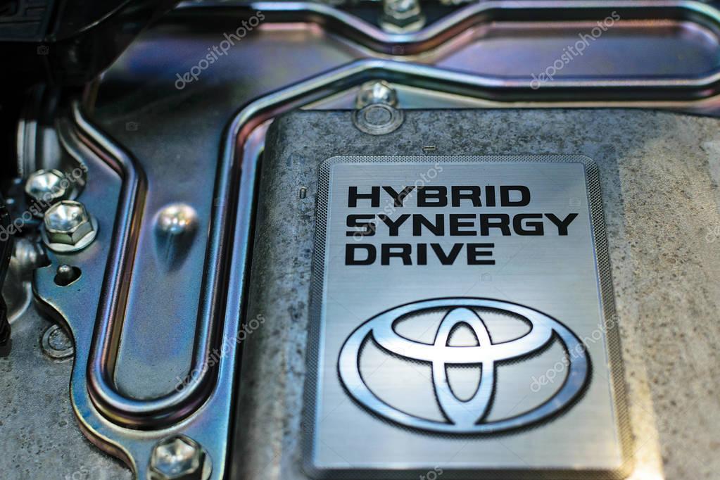 Krakow, Poland, May 21, 2017: Toyota Hybrid Synergy Drive sign close-up during MotoShow in Krakow. Toyota is a famous Japanese multinational automaker.