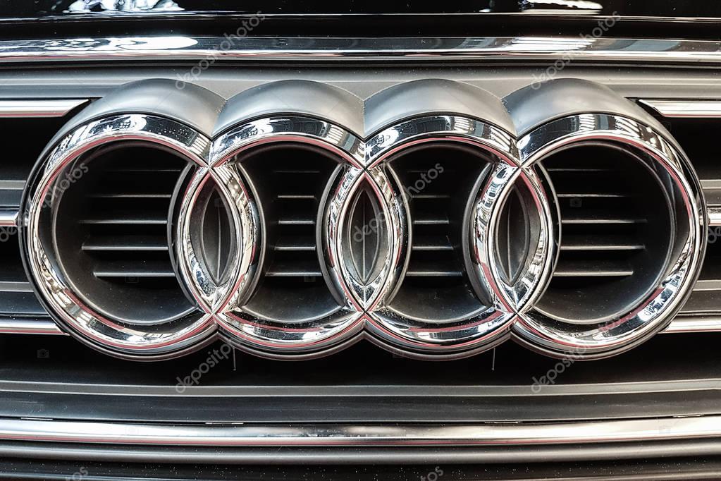 Lubin, Poland - November 17, 2017: Audi emblem on a car grill. Audi is a German automobile manufacturer that designs,  produces and distributes luxury automobiles.