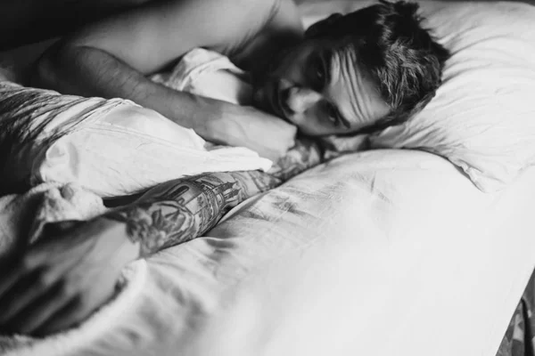 Man with bristle lying on pillow — Stock Photo, Image